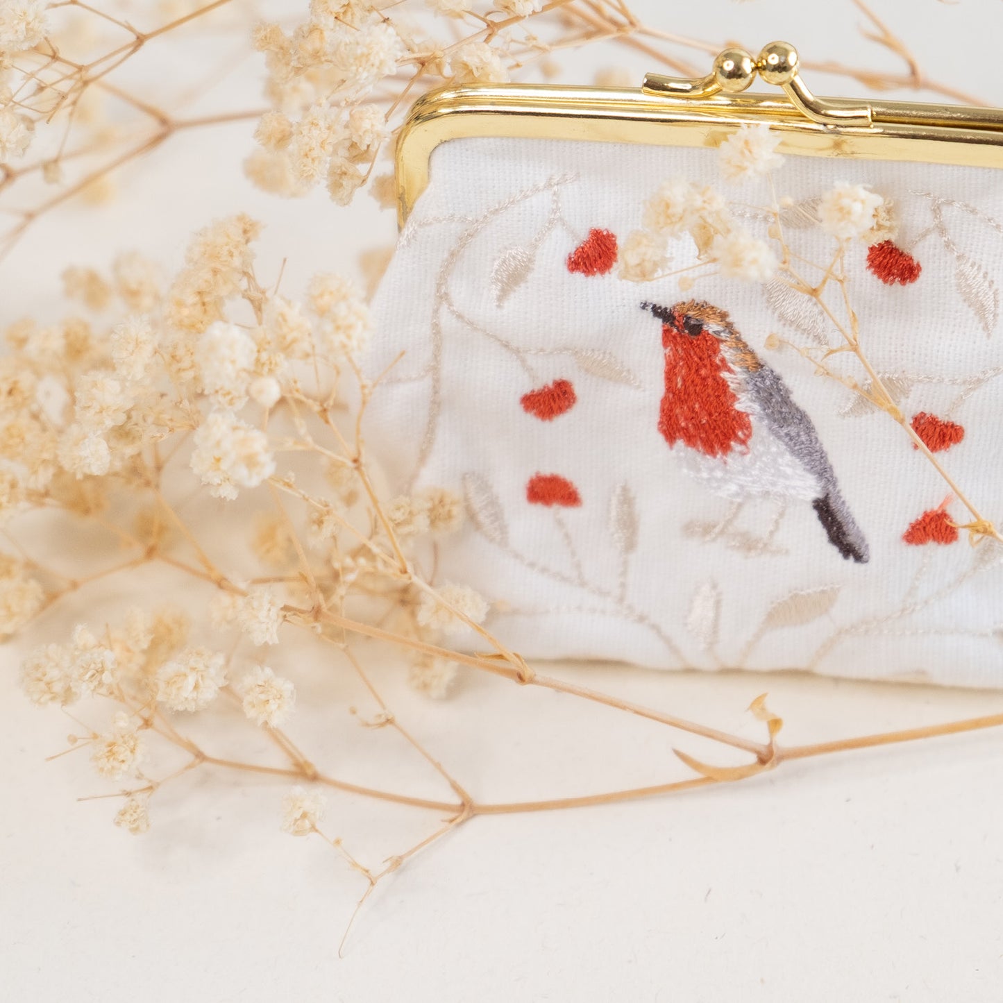 Torbica z izvezenim motivom taščice